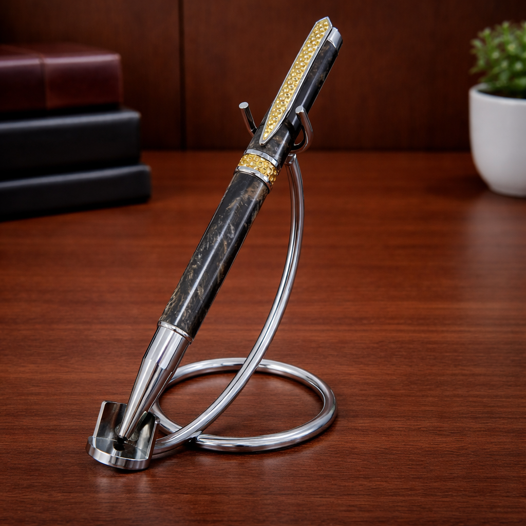 Luxury black and gold pen with stand on wooden desk, office decor in background
