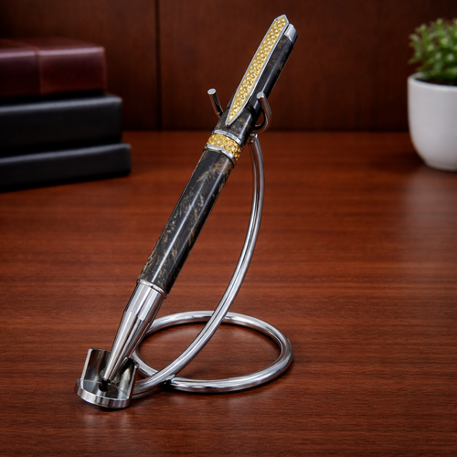 Luxury black and gold pen with stand on wooden desk, office decor in background
