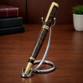 Luxury brown and gold pen with textured barrel on chrome stand, office desk background
