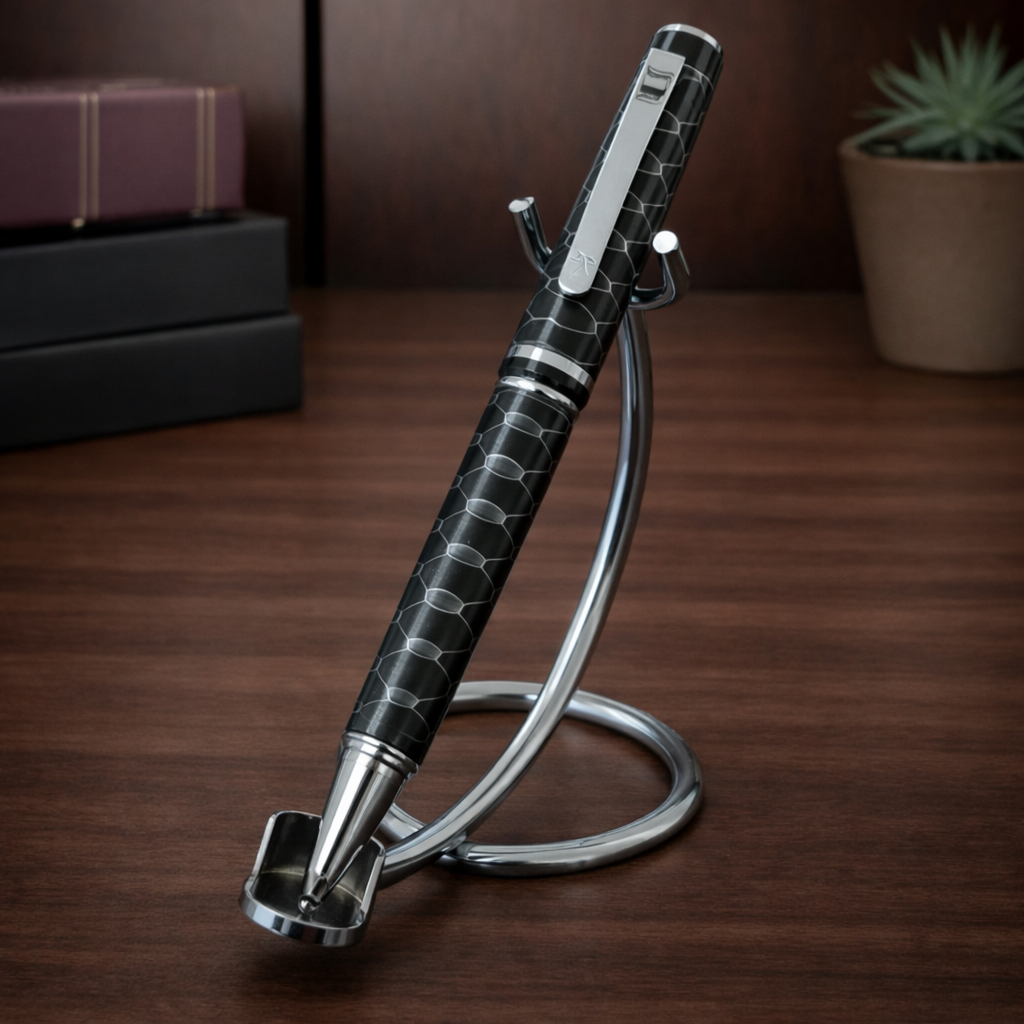 Luxury black patterned pen on chrome stand, desk background, writing instrument